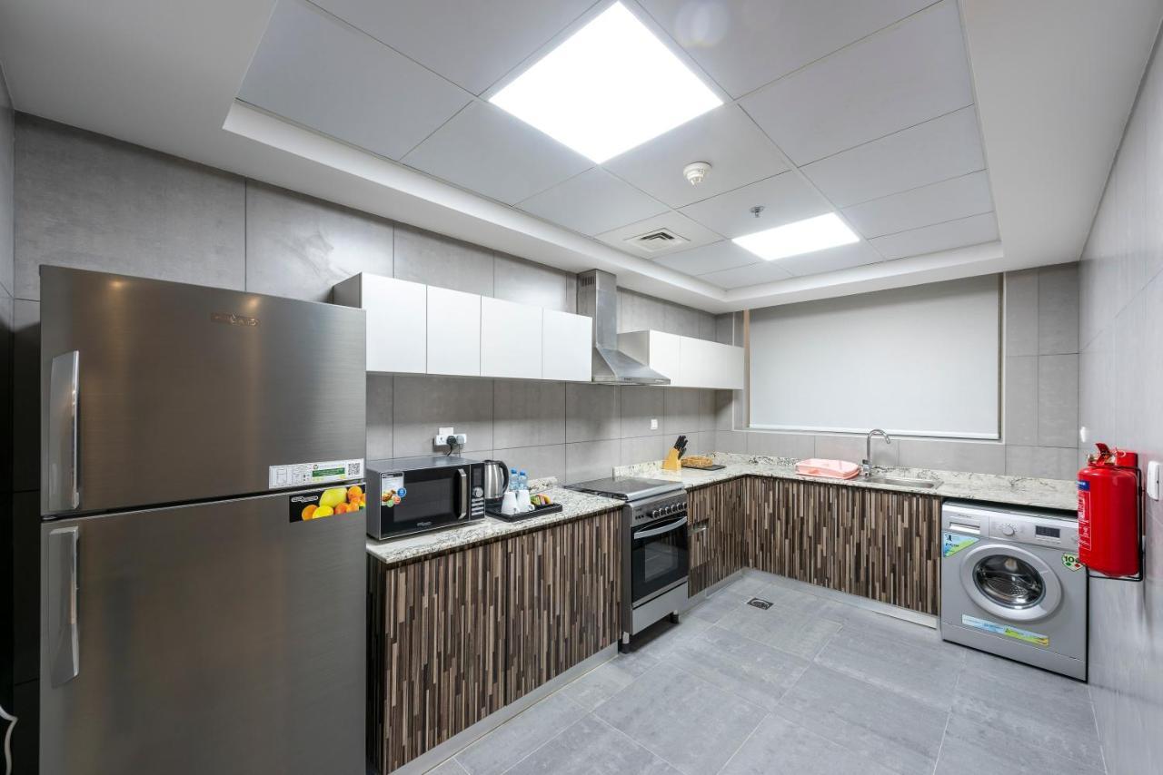 Luxe Grand Hotel Apartments Sharjah Exterior foto A typical kitchen in a residential hall
